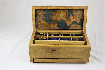 Map effect design inside lid of oak jewellery box by Reuben's woodcraft